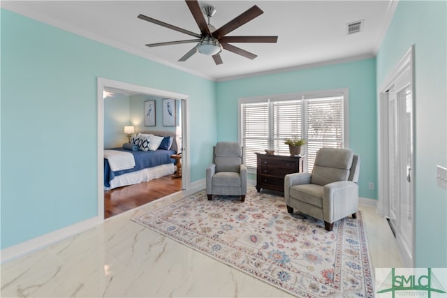 living area with ceiling fan and ornamental molding