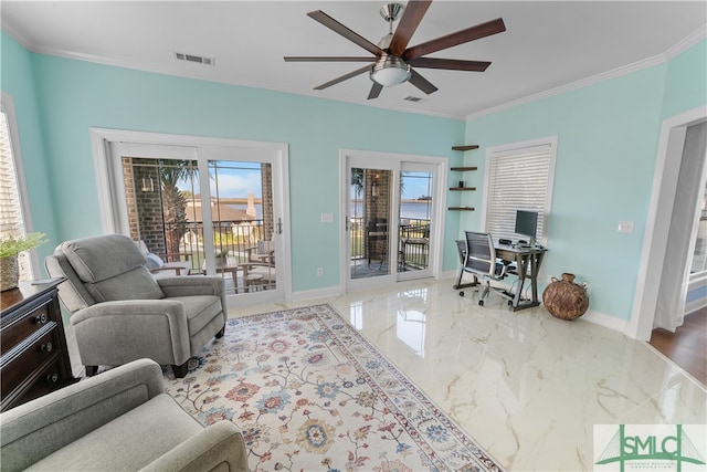 living room with ceiling fan, plenty of natural light, and crown molding