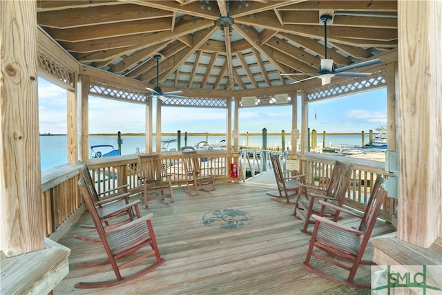 dock area with a gazebo and a water view