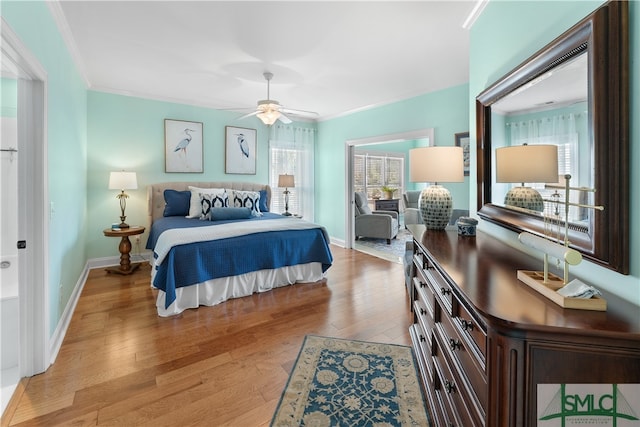 bedroom with light hardwood / wood-style flooring, ceiling fan, and crown molding