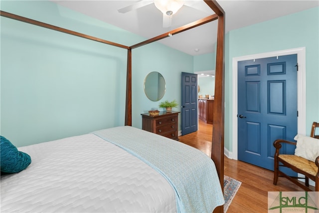 bedroom with ceiling fan and light hardwood / wood-style flooring