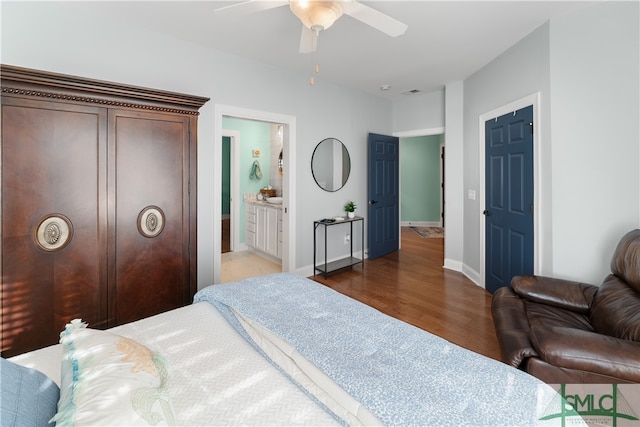 bedroom featuring connected bathroom, ceiling fan, and hardwood / wood-style flooring