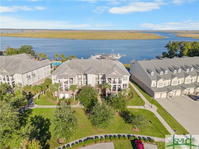 birds eye view of property with a water view