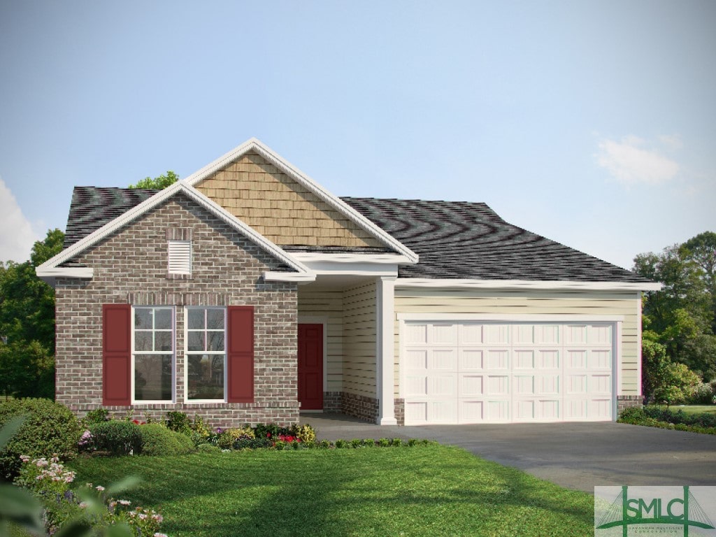 view of front facade featuring a garage and a front lawn