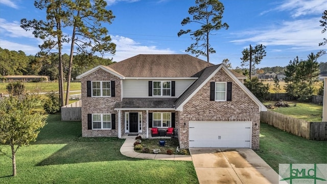 view of front of house featuring a garage and a front yard