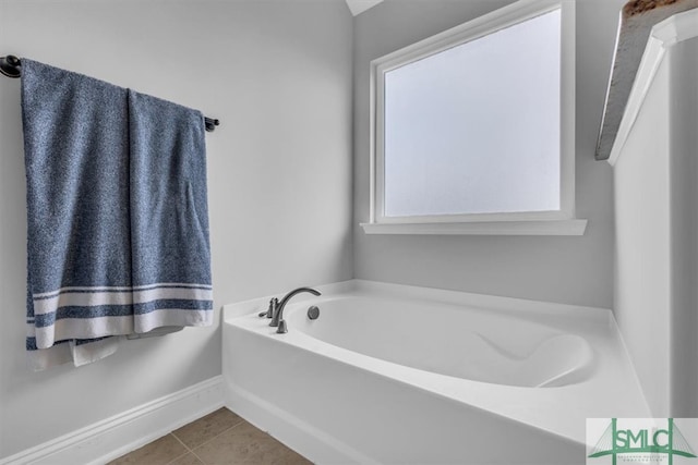 bathroom featuring a bath and tile patterned floors