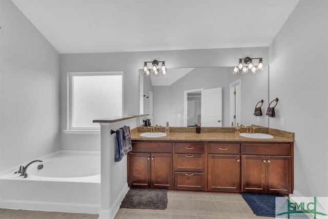 bathroom with vanity, a tub, tile patterned floors, and lofted ceiling