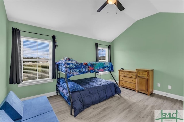 bedroom featuring light wood-type flooring, ceiling fan, and vaulted ceiling