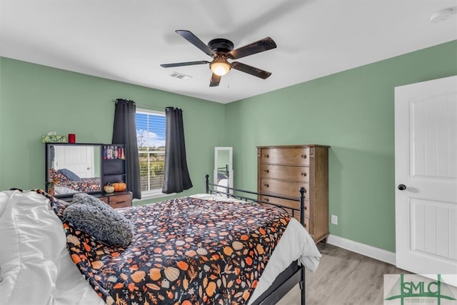 bedroom featuring ceiling fan and light hardwood / wood-style flooring