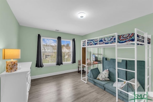 bedroom featuring hardwood / wood-style floors