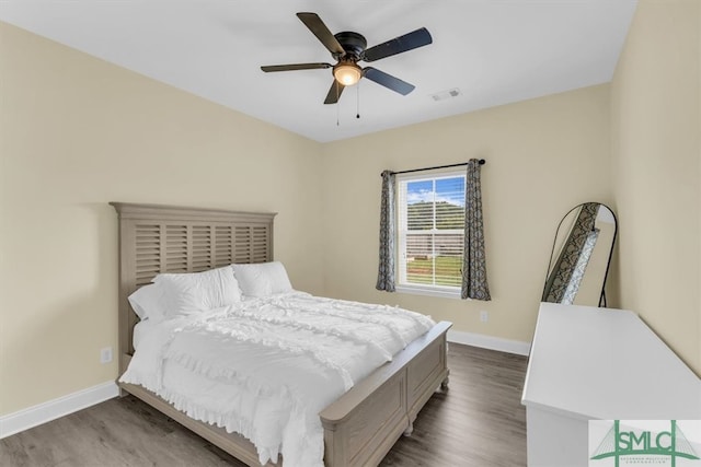 bedroom featuring hardwood / wood-style floors and ceiling fan