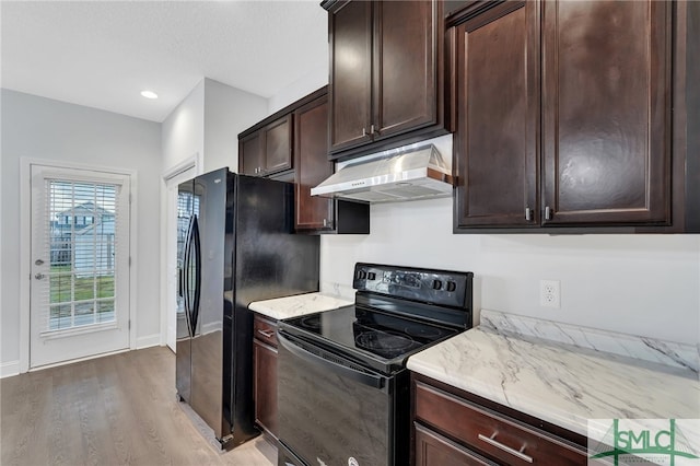 kitchen with light wood-type flooring, dark brown cabinetry, and black appliances