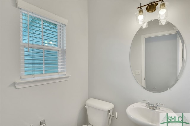 bathroom featuring sink and toilet