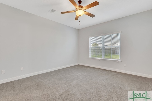 spare room with carpet floors and ceiling fan