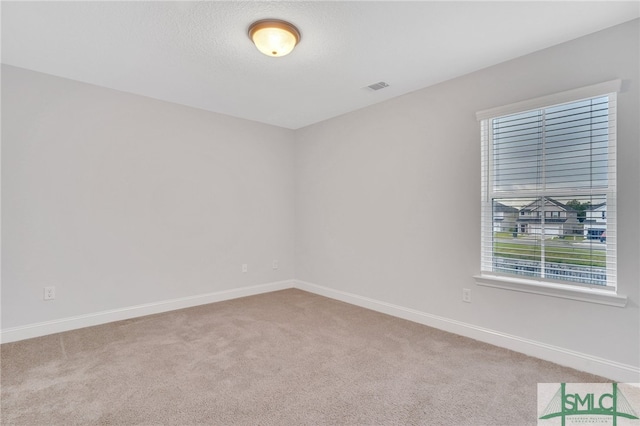 view of carpeted spare room