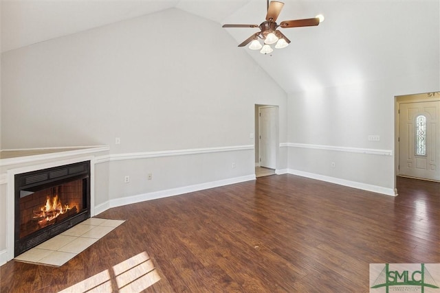 unfurnished living room with ceiling fan, wood-type flooring, and high vaulted ceiling