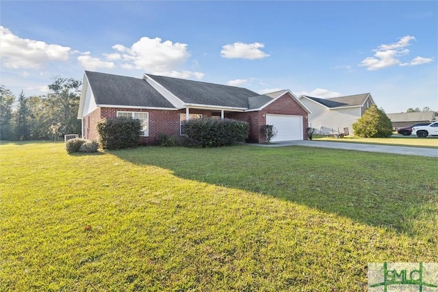 view of front facade with a front yard and a garage