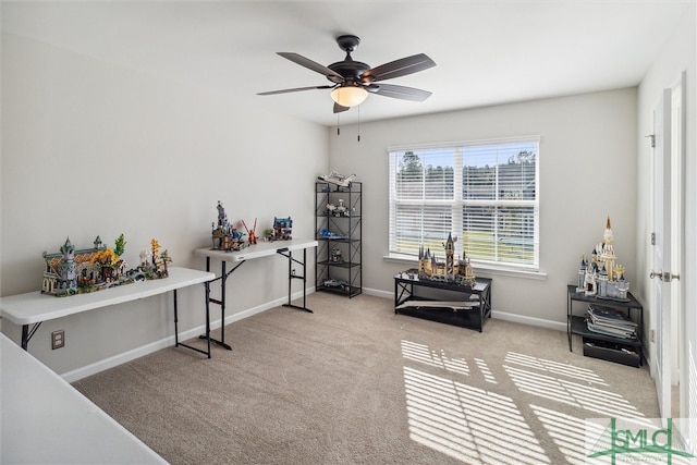 interior space featuring ceiling fan and light carpet