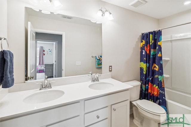 full bathroom with shower / bath combo, vanity, and toilet