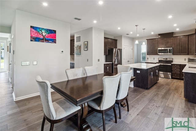 dining area featuring light hardwood / wood-style floors