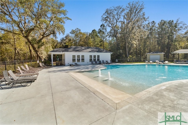 view of swimming pool with a patio