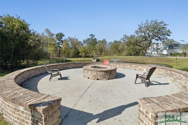 view of community with a patio and a fire pit