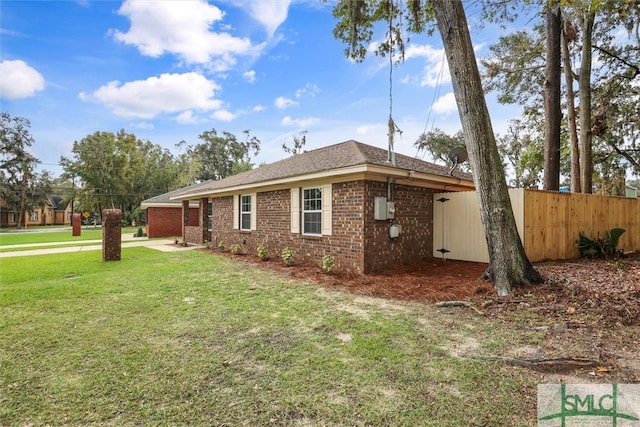 view of side of property featuring a yard