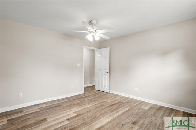 unfurnished room with ceiling fan and light hardwood / wood-style flooring