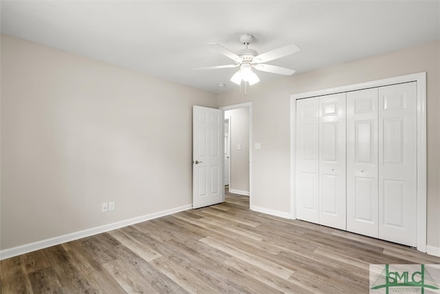 unfurnished bedroom featuring a closet, ceiling fan, and light wood-type flooring