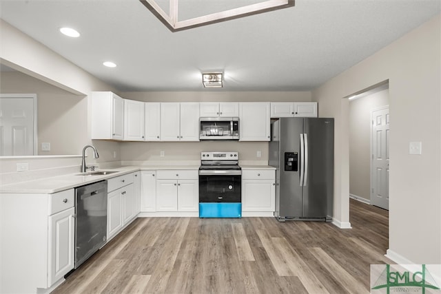 kitchen featuring white cabinetry, sink, and stainless steel appliances