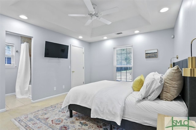 bedroom with ceiling fan and light colored carpet