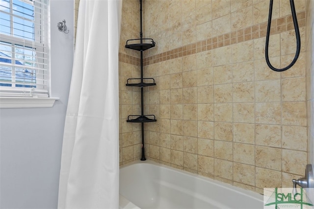 bathroom featuring shower / bath combination with curtain