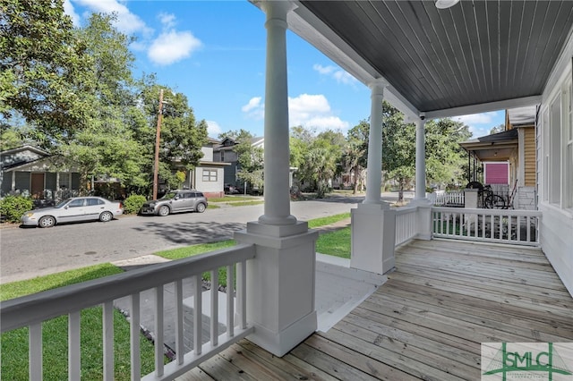 wooden terrace with a porch