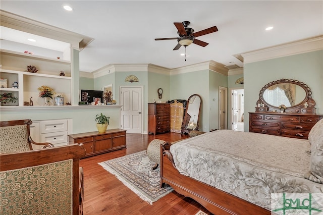 bedroom with ceiling fan, light hardwood / wood-style floors, and ornamental molding