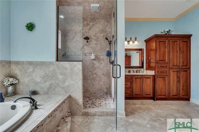 bathroom featuring vanity, ornamental molding, and shower with separate bathtub