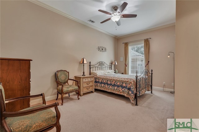 carpeted bedroom with ceiling fan and crown molding