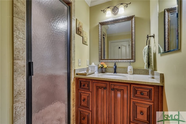 bathroom featuring vanity, crown molding, and a shower with door