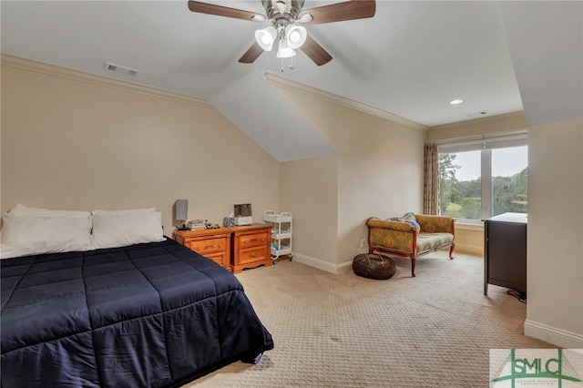 carpeted bedroom with ceiling fan, crown molding, and vaulted ceiling