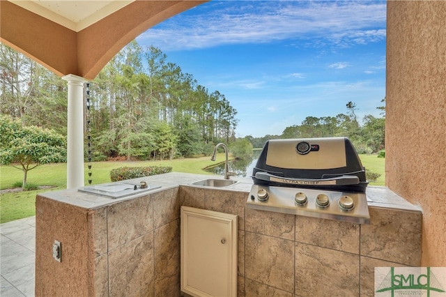 view of patio with sink, grilling area, and exterior kitchen