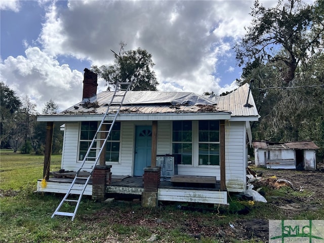 bungalow-style house with covered porch and solar panels