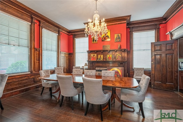 18 E 34th St, Savannah, GA 31401 - dining area featuring crown molding, a chandelier, dark wood-style floors, plenty of natural light, and wainscoting