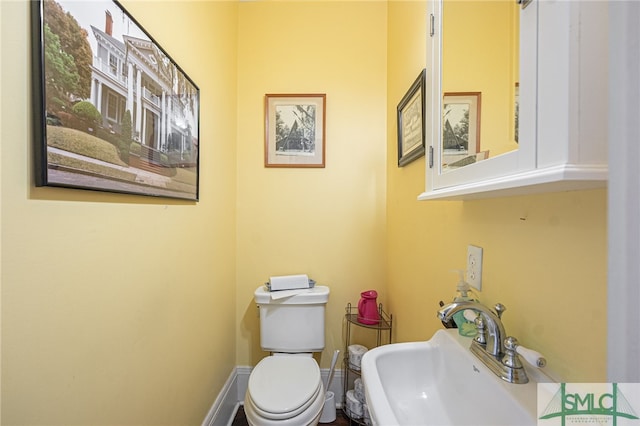 18 E 34th St, Savannah, GA 31401 - half bathroom with a sink and toilet
