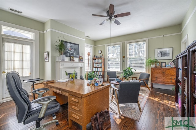 18 E 34th St, Savannah, GA 31401 - office space featuring ceiling fan, dark wood finished floors, and a brick fireplace