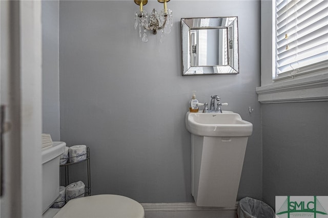 18 E 34th St, Savannah, GA 31401 - half bath featuring toilet and a chandelier