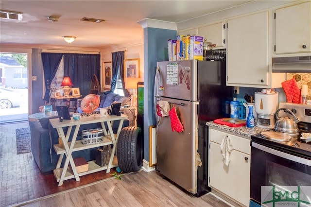 kitchen featuring white cabinetry, appliances with stainless steel finishes, and light hardwood / wood-style flooring