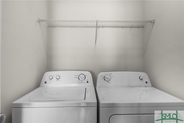 laundry area with washing machine and dryer