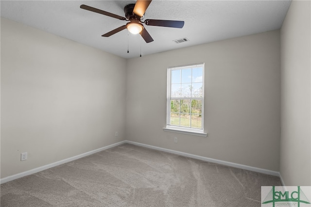 carpeted empty room with ceiling fan