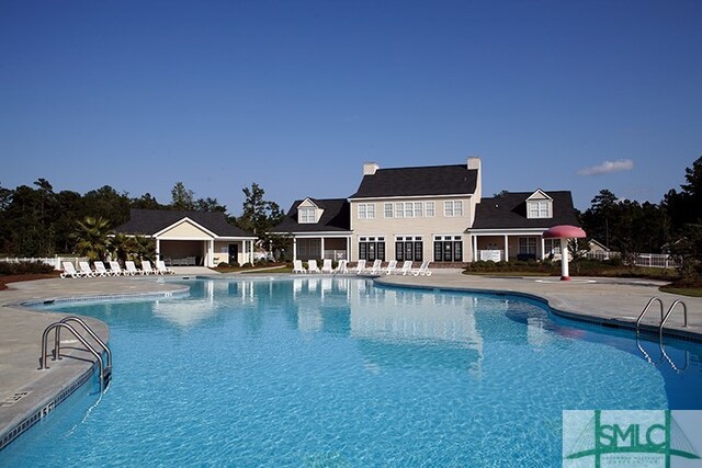 view of swimming pool with a patio area