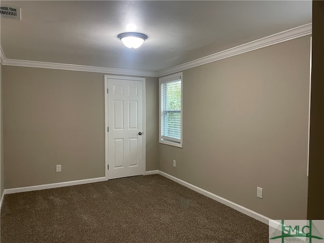 carpeted spare room featuring ornamental molding