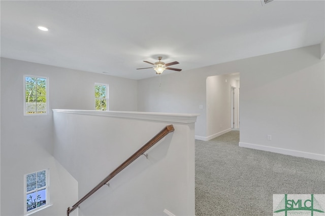 hallway with light carpet